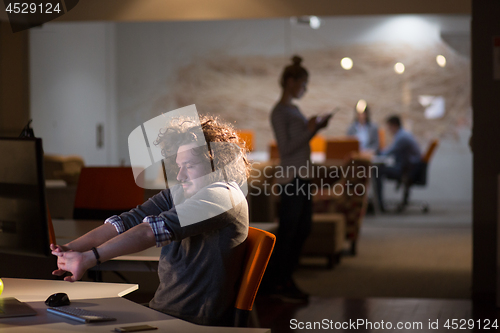 Image of businessman relaxing at the desk