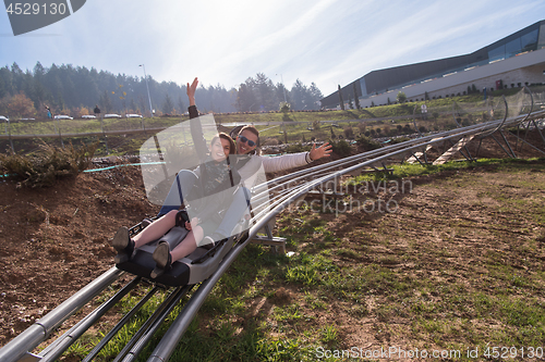 Image of couple enjoys driving on alpine coaster