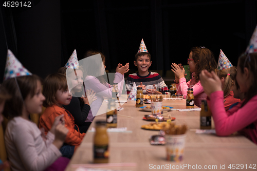 Image of The young boy joyfully celebrating his birthday