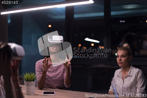 Image of Multiethnic Business team using virtual reality headset