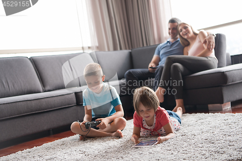 Image of couple spending time with kids