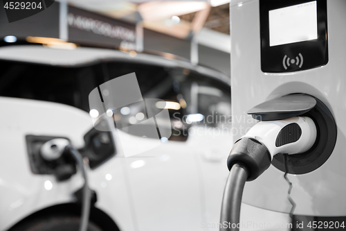 Image of Electric car getting recharged at station