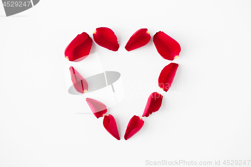 Image of heart shape made of red rose petals