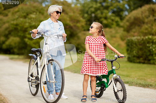 Image of grandmother and granddaughter with bicycles