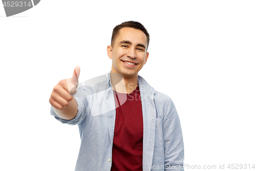 Image of happy young man showing thumbs up