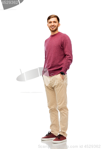 Image of smiling young man over white background