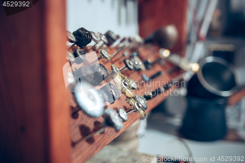 Image of Different goldsmiths tools on the jewelry workplace. work in jewelry.