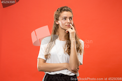 Image of Young serious thoughtful woman. Doubt concept.