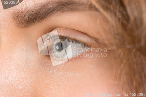 Image of The close up eye on face of young beautiful caucasian girl