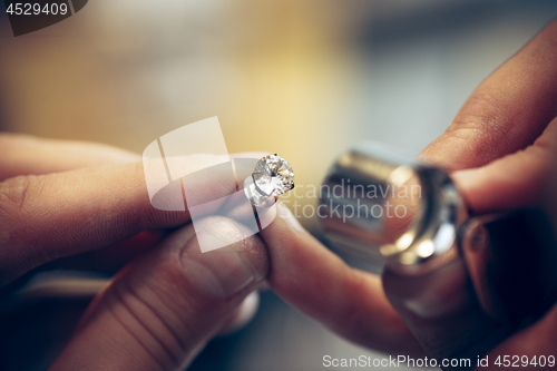 Image of Different goldsmiths tools on the jewelry workplace. Jeweler at work in jewelry.