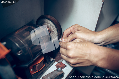 Image of Different goldsmiths tools on the jewelry workplace. Jeweler at work in jewelry.