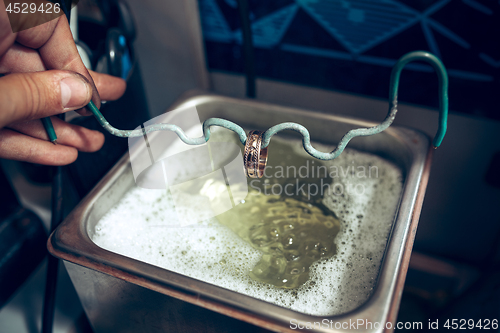 Image of Different goldsmiths tools on the jewelry workplace. Jeweler at work in jewelry.
