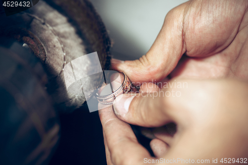 Image of Different goldsmiths tools on the jewelry workplace. Jeweler at work in jewelry.