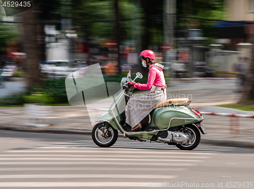 Image of Woman on scooter in Ho Chi Minh City