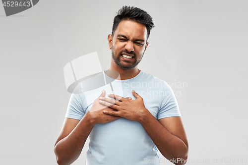 Image of unhappy indian man suffering from heartache