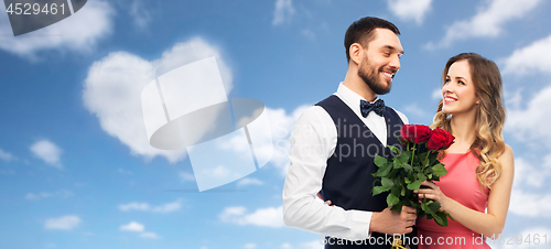 Image of couple with bunch of flowers on valentines day