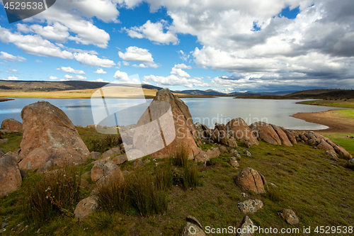 Image of Rocky tors lakes and fields of Snowy High Plains