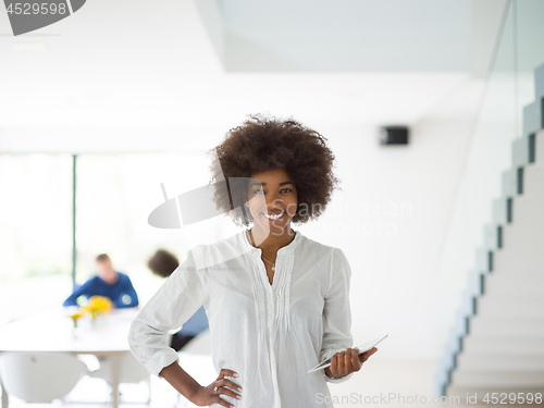 Image of Portrait of  black casual businesswoman using tablet  with cowor