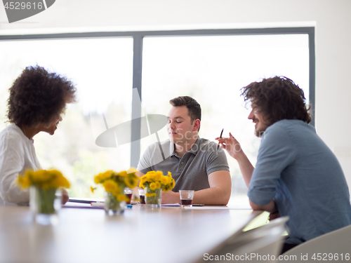 Image of Multiethnic startup Business Team At A Meeting at modern office 