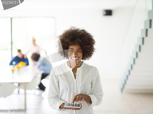 Image of Portrait of  black casual businesswoman using tablet  with cowor