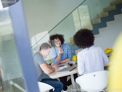 Image of Multiethnic startup Business Team At A Meeting at modern office 