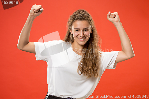 Image of Winning success woman happy ecstatic celebrating being a winner. Dynamic energetic image of female model