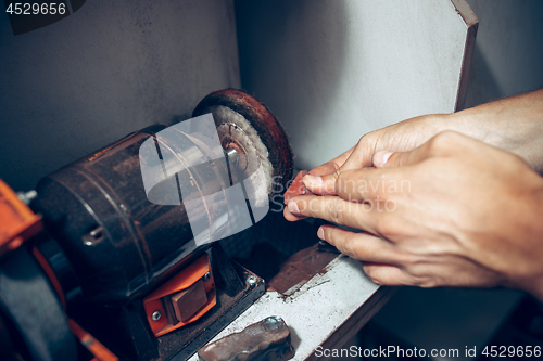 Image of Different goldsmiths tools on the jewelry workplace. Jeweler at work in jewelry.