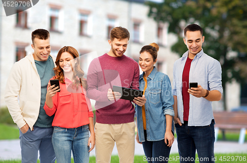 Image of students with smartphones and tablet computer