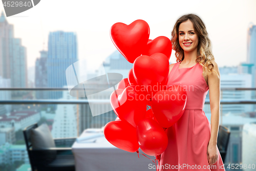 Image of woman with red heart shaped balloons in singapore