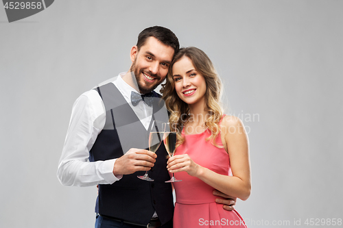 Image of happy couple with champagne glasses toasting