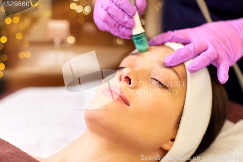 Image of woman having microdermabrasion facial treatment