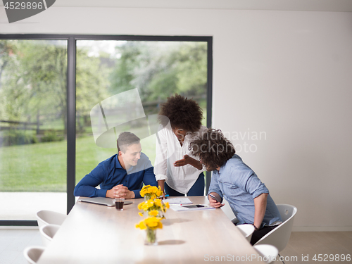 Image of Multiethnic startup Business Team At A Meeting at modern office 