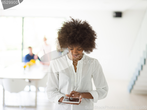 Image of Portrait of  black casual businesswoman using tablet  with cowor