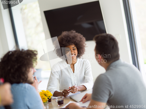 Image of Multiethnic startup Business Team At A Meeting at modern office 
