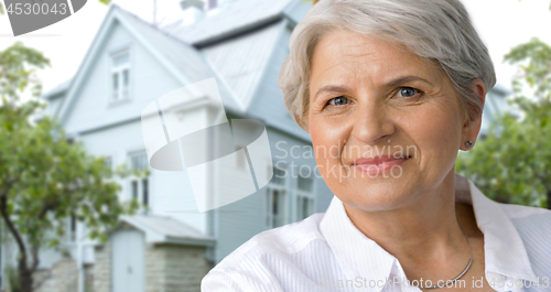 Image of portrait of smiling senior woman