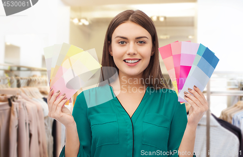 Image of woman with color swatches at clothing store