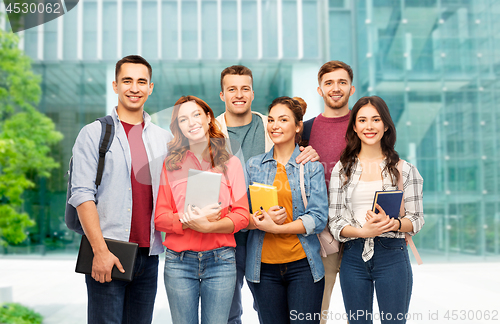 Image of group of students over university background