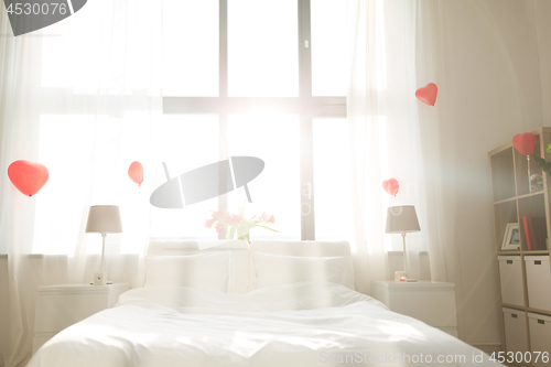 Image of cozy bedroom decorated for valentines day