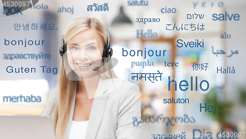 Image of woman in headset over words in foreign languages