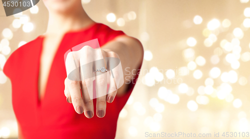 Image of close up of female hand with diamond ring