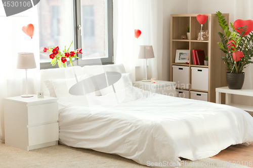 Image of cozy bedroom decorated for valentines day