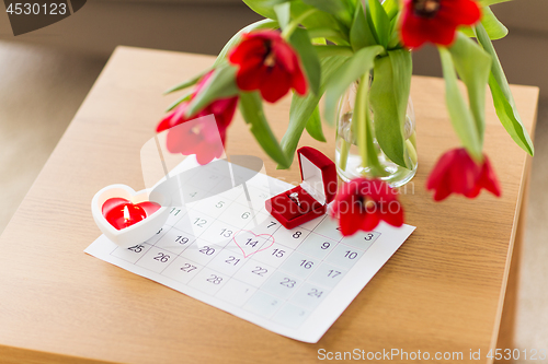 Image of diamond ring and calendar sheet on valentines day