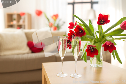 Image of champagne glasses and flowers on valentines day