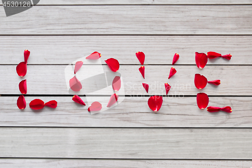 Image of word love made of red rose petals