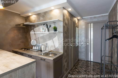 Image of View of the kitchen and the entrance to the hotel room