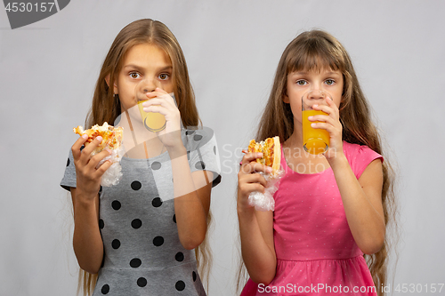 Image of Two girls write dried meat juice