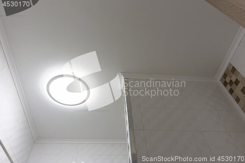 Image of Ceiling with lamp in the bathroom