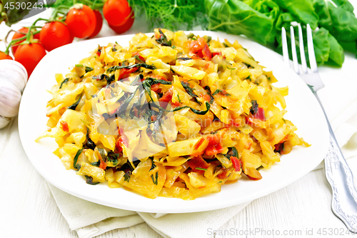 Image of Cabbage stew with chard in plate on light board