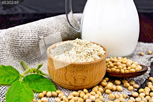 Image of Flour soy in bowl with soybeans and milk on napkin