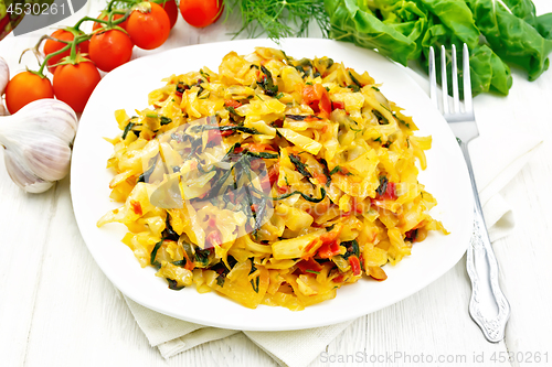 Image of Cabbage stew with chard in plate on board